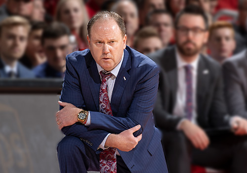 Photo Coach Gard on the Sidelines of the court.