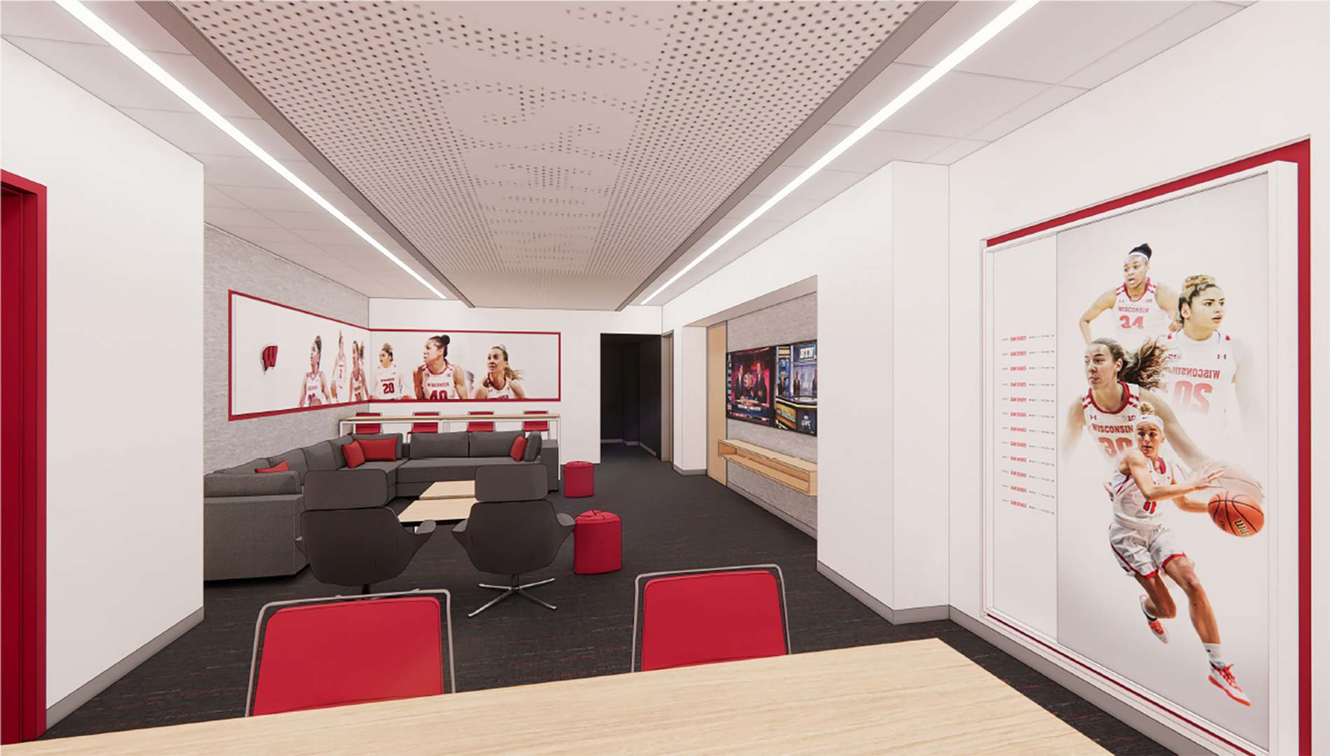A rendering of a large lounge area with photos of female basketball student-athletes with a table in for foreground, a large L shaped couch in the background with a TV on one of the walls.