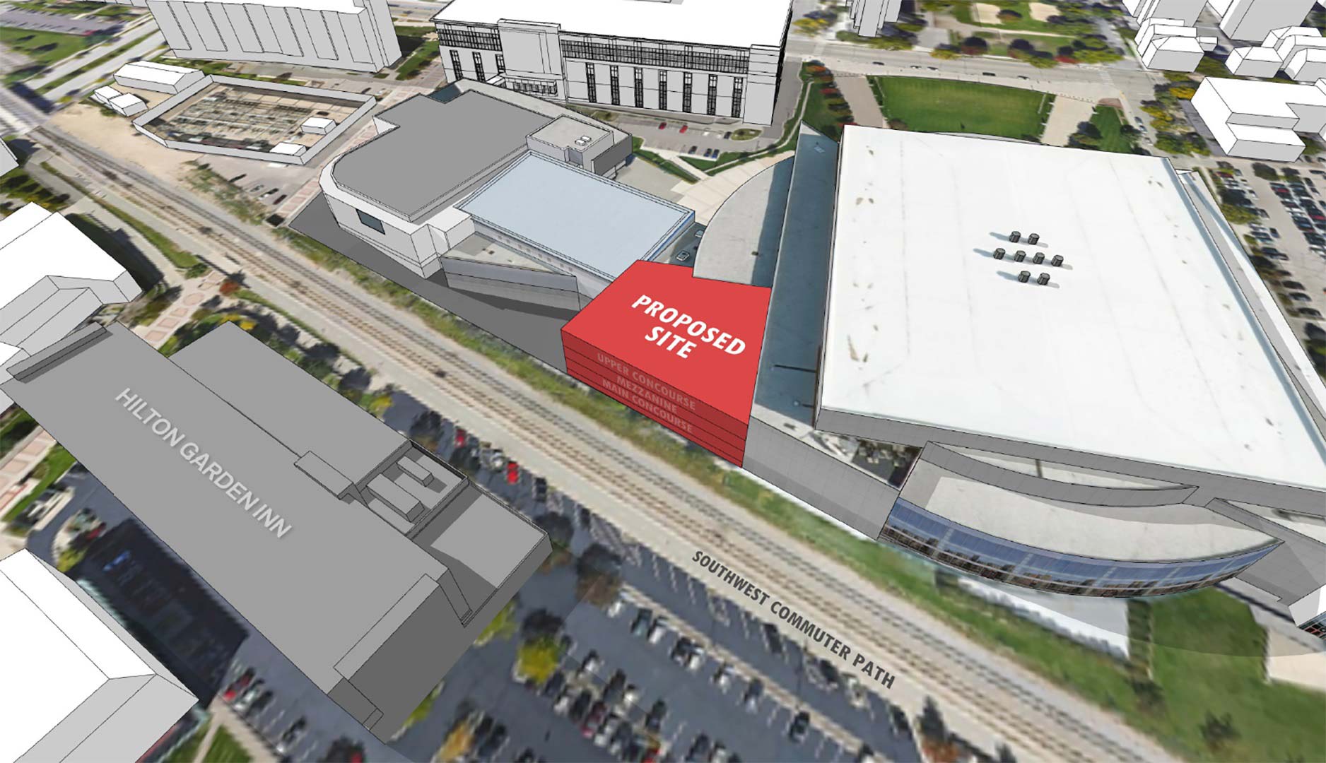 A rendering view from the sky overhead of the proposed building site. It shows the existing buildings that are part of the Kohl Center complex as well as the surrounding business and other university buildings.